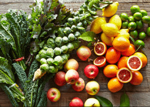 a group of fruits and vegetables on a wood surface Healthy Weight Loss Diets Newcastle under Lyme